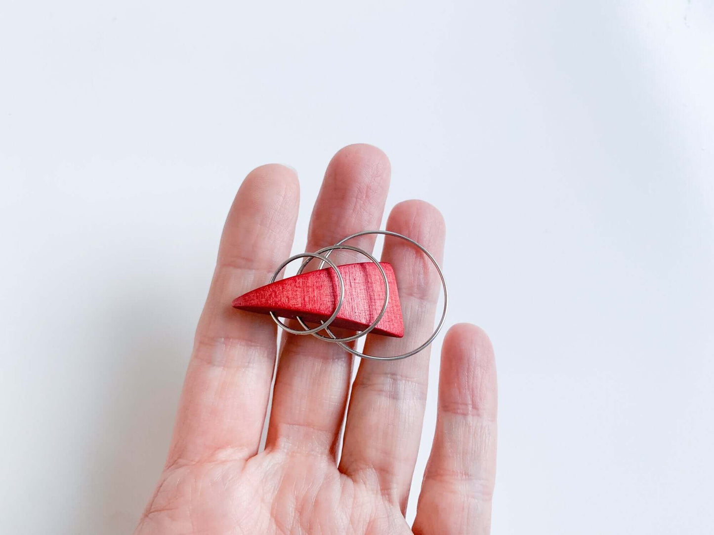 Wooden stylish red triangle brooch by Aarikka Finland