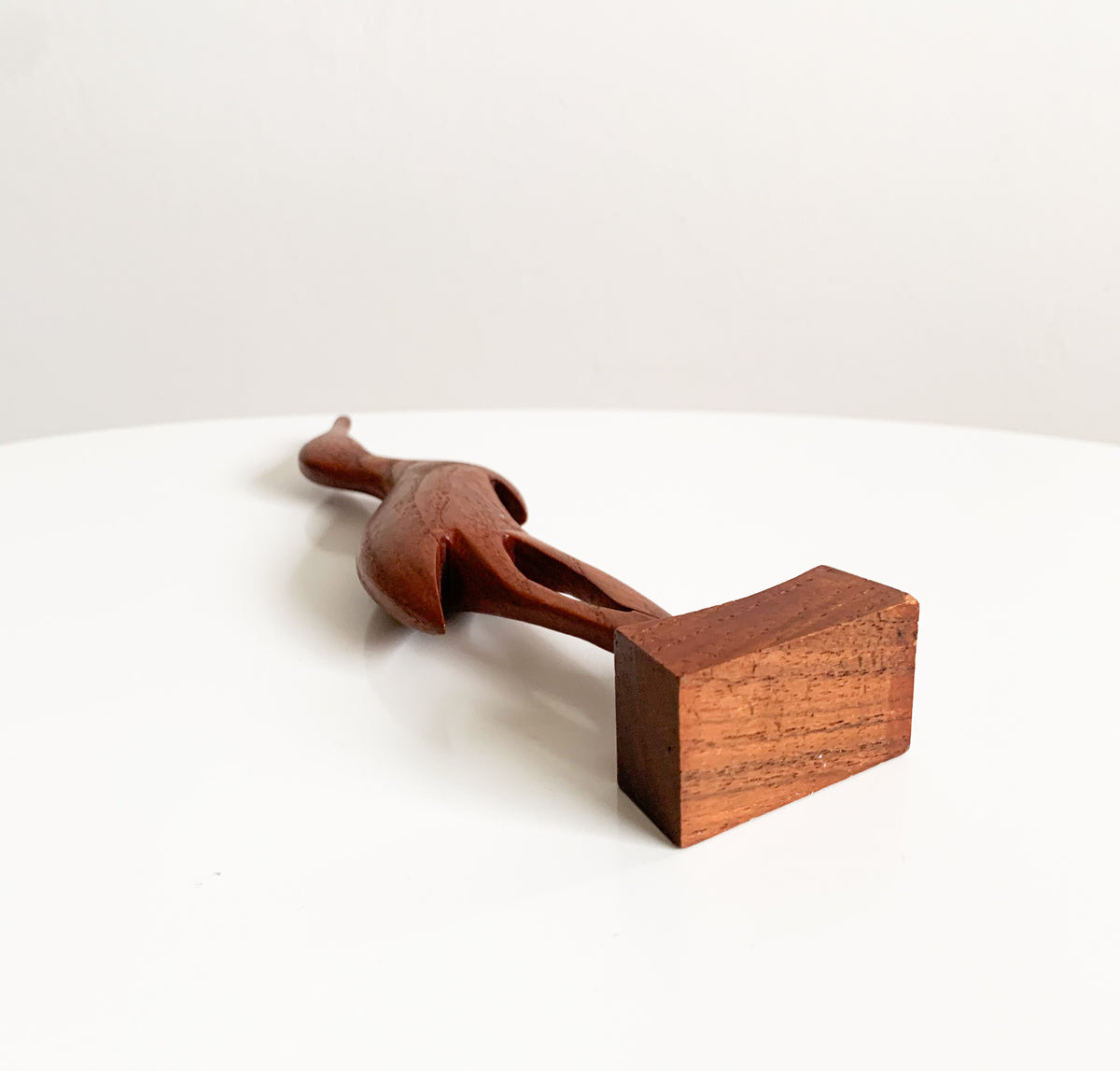 Teak heron figurine