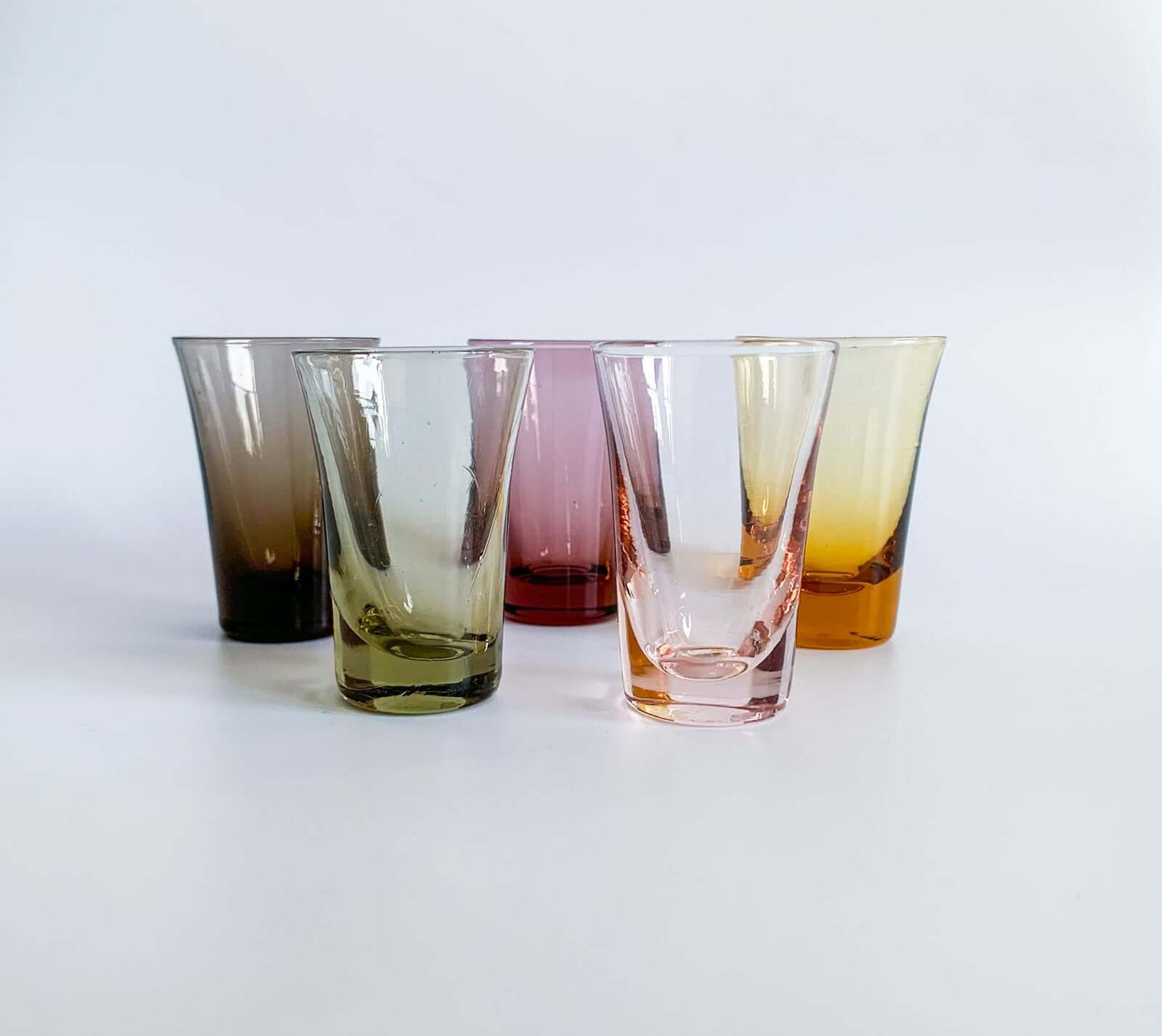 Set of vintage shot glasses in multicolored glass