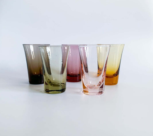Set of vintage shot glasses in multicolored glass