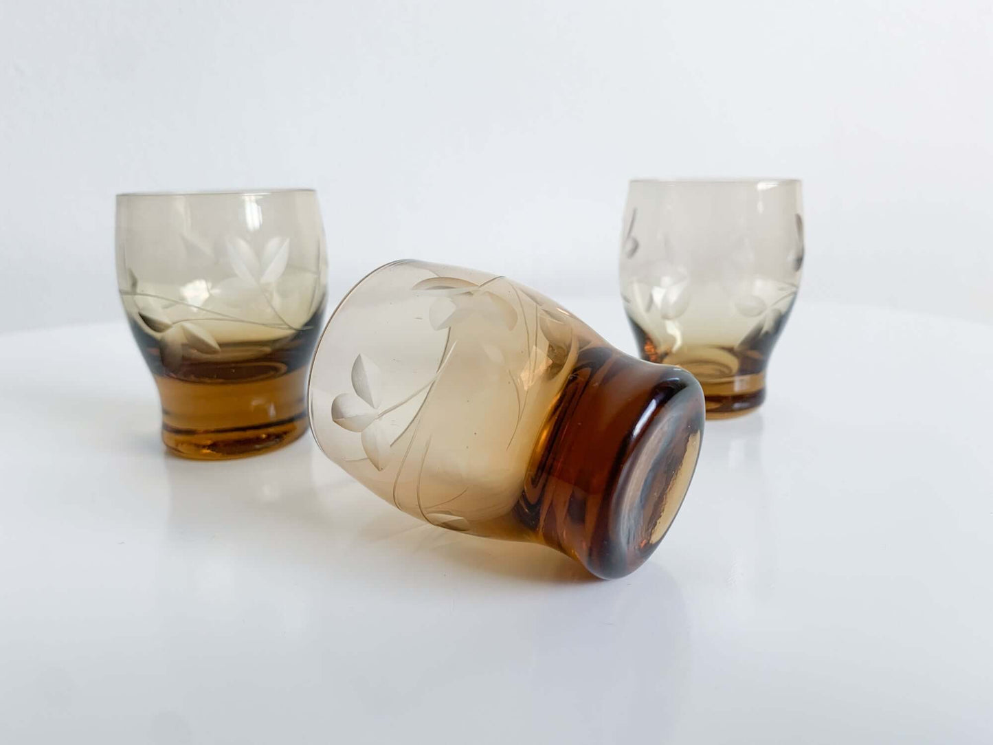 Trio of engraved shot glasses, designer Ilmari Kumela, 1950s Finland