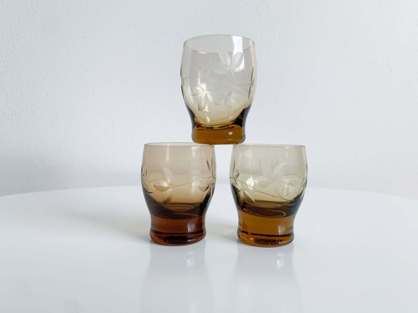 Trio of engraved shot glasses, designer Ilmari Kumela, 1950s Finland