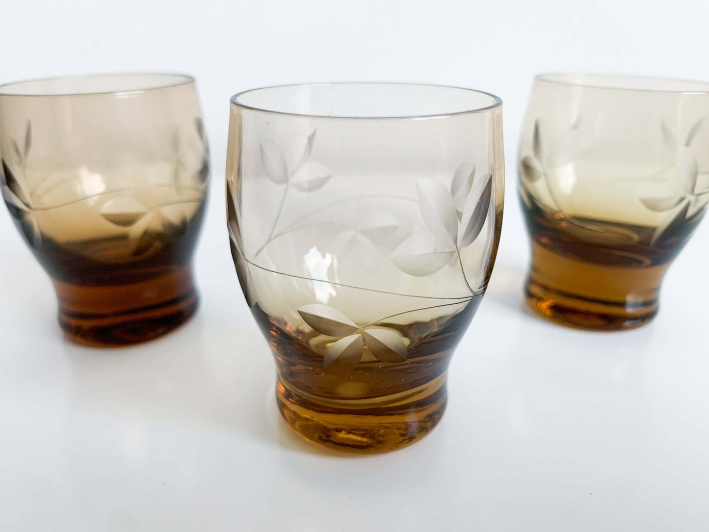 Trio of engraved shot glasses, designer Ilmari Kumela, 1950s Finland