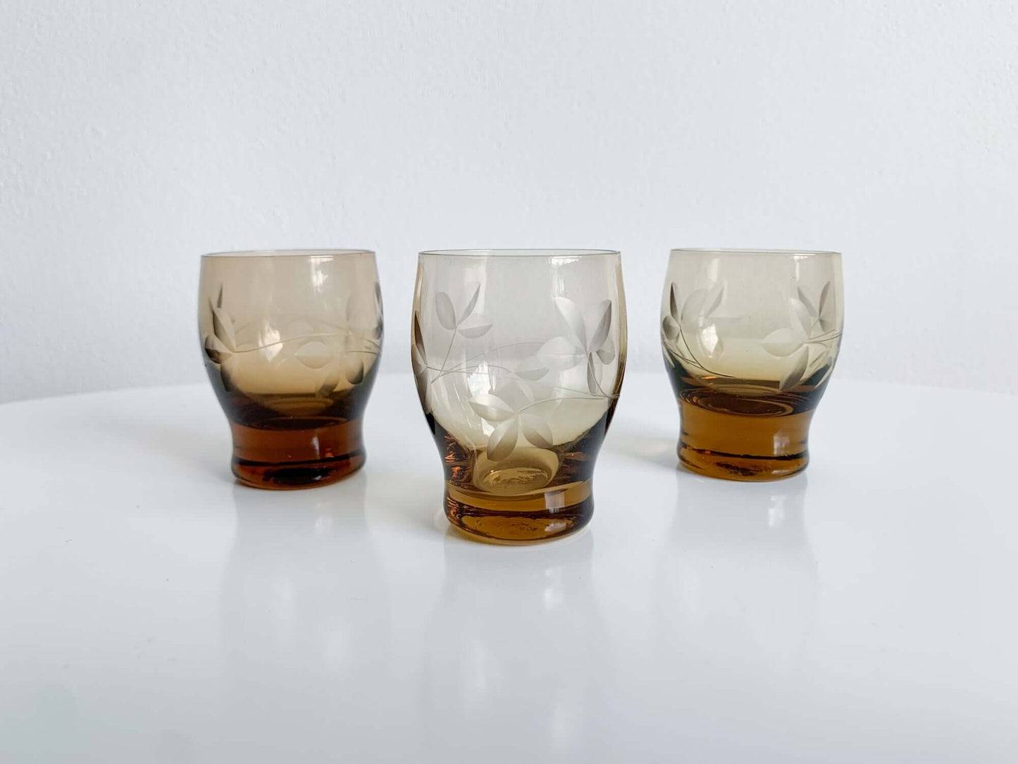 Trio of engraved shot glasses, designer Ilmari Kumela, 1950s Finland