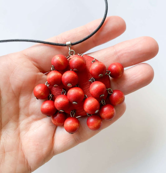 Aarikka Finland | Rare wooden pendant with cranberry red beads