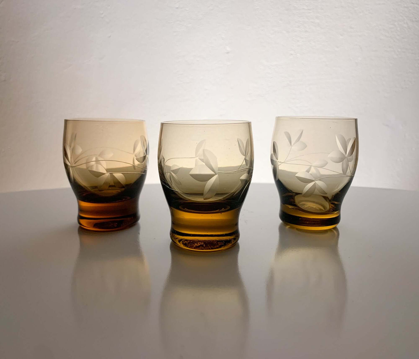 Trio of engraved shot glasses, designer Ilmari Kumela, 1950s Finland