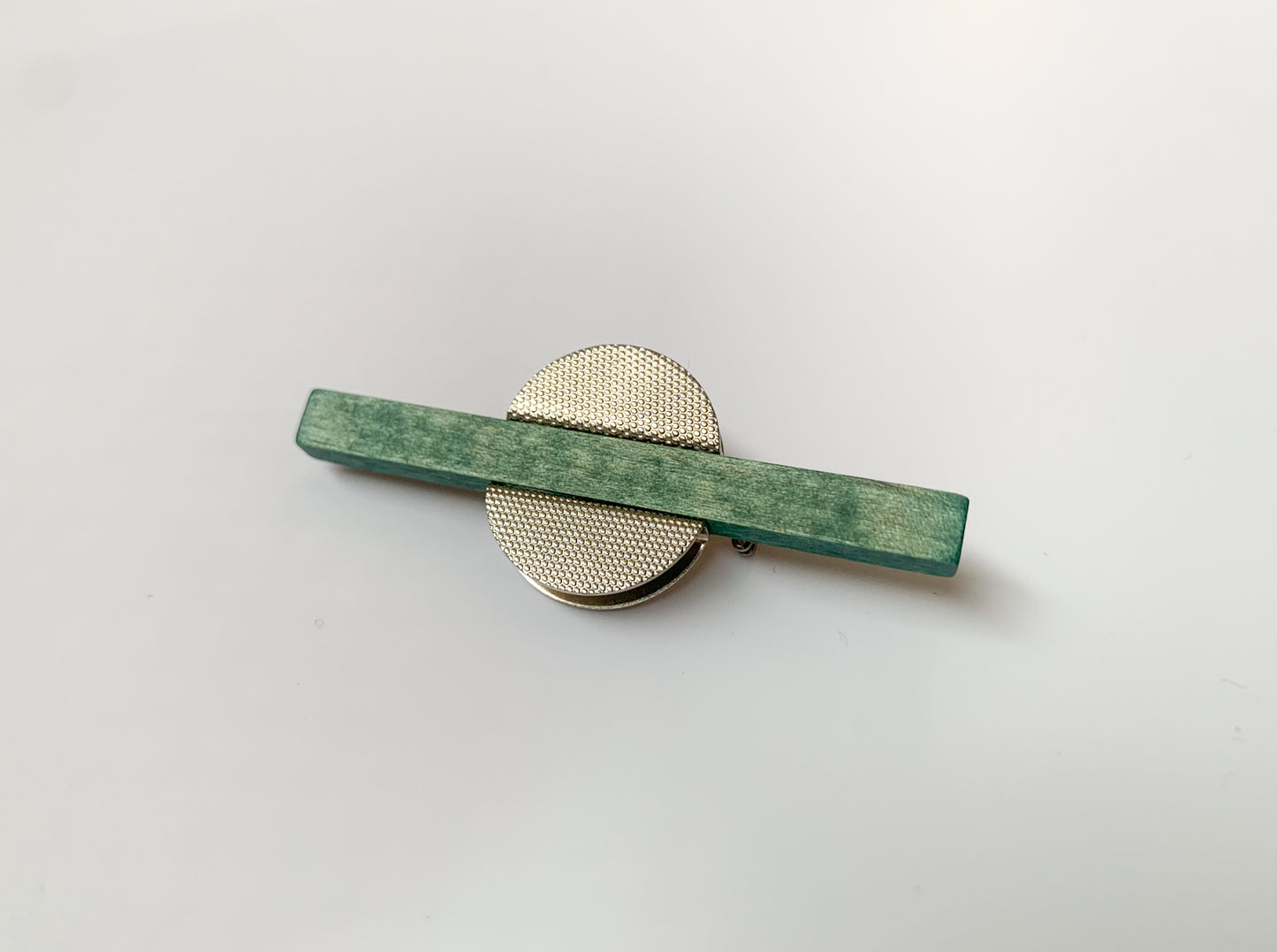 Green wood and metal brooch by Aarikka Finland