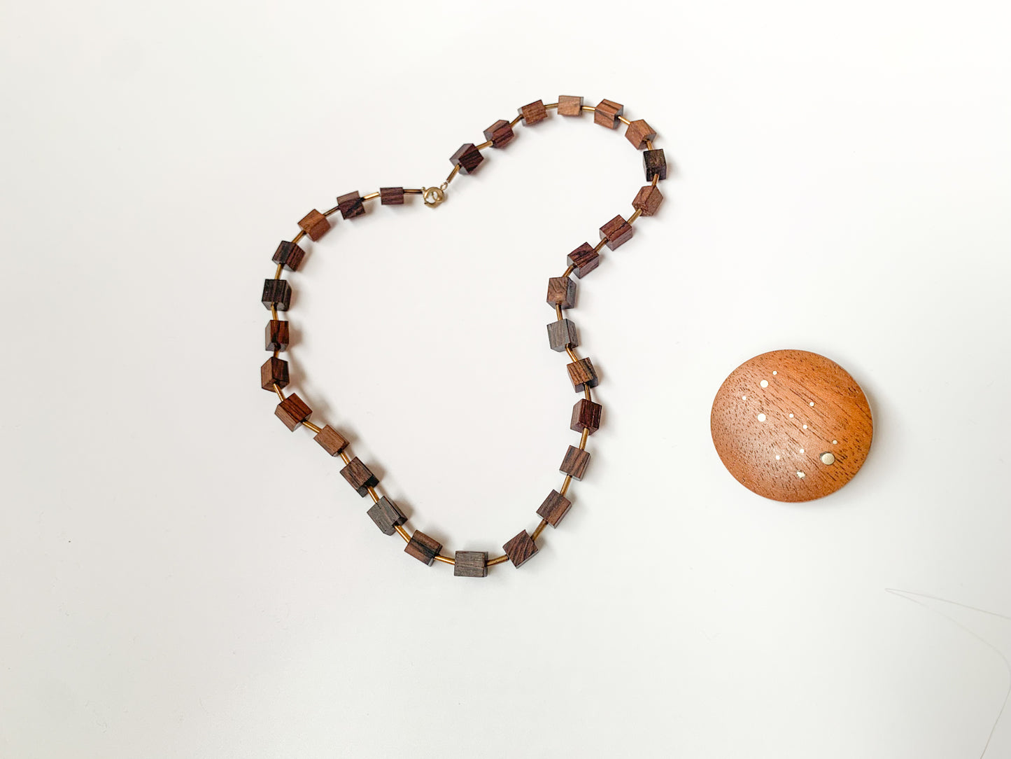 Modernist wood brooch with metal dots 1960s