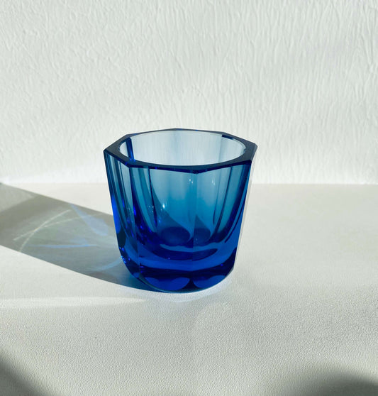 Art Deco vintage glass in a vibrant blue color, showcasing geometric design and elegant style.