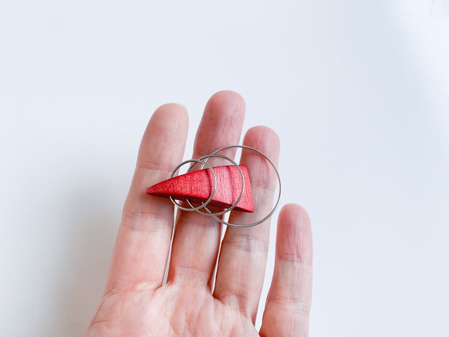 Wooden stylish red triangle brooch by Aarikka Finland