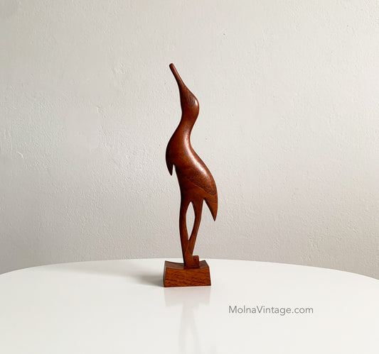 Teak heron figurine