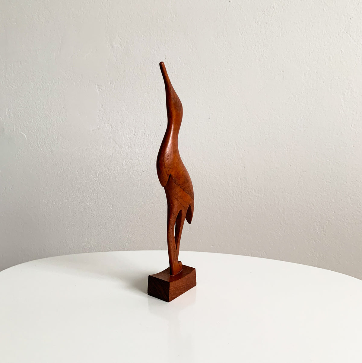 Teak heron figurine