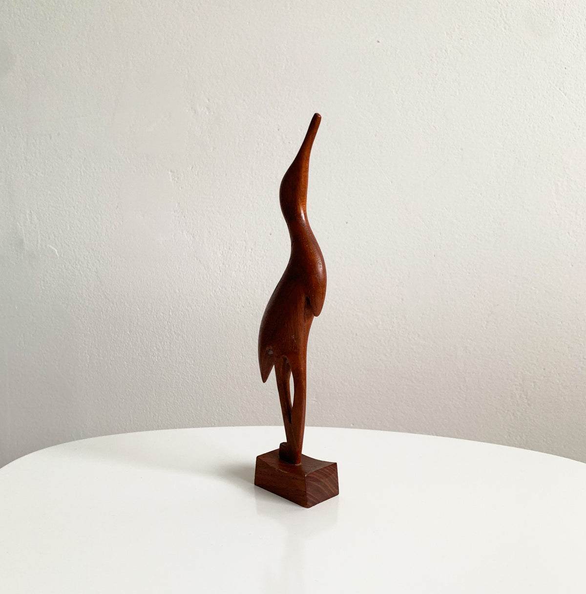 Teak heron figurine
