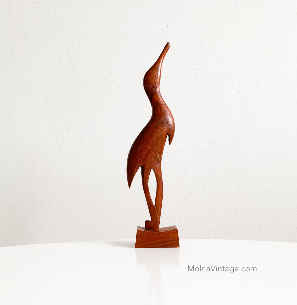 Teak heron figurine