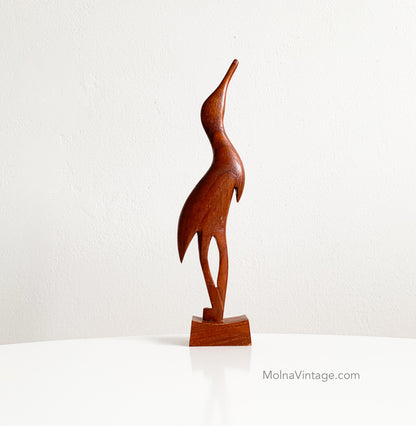 Teak heron figurine