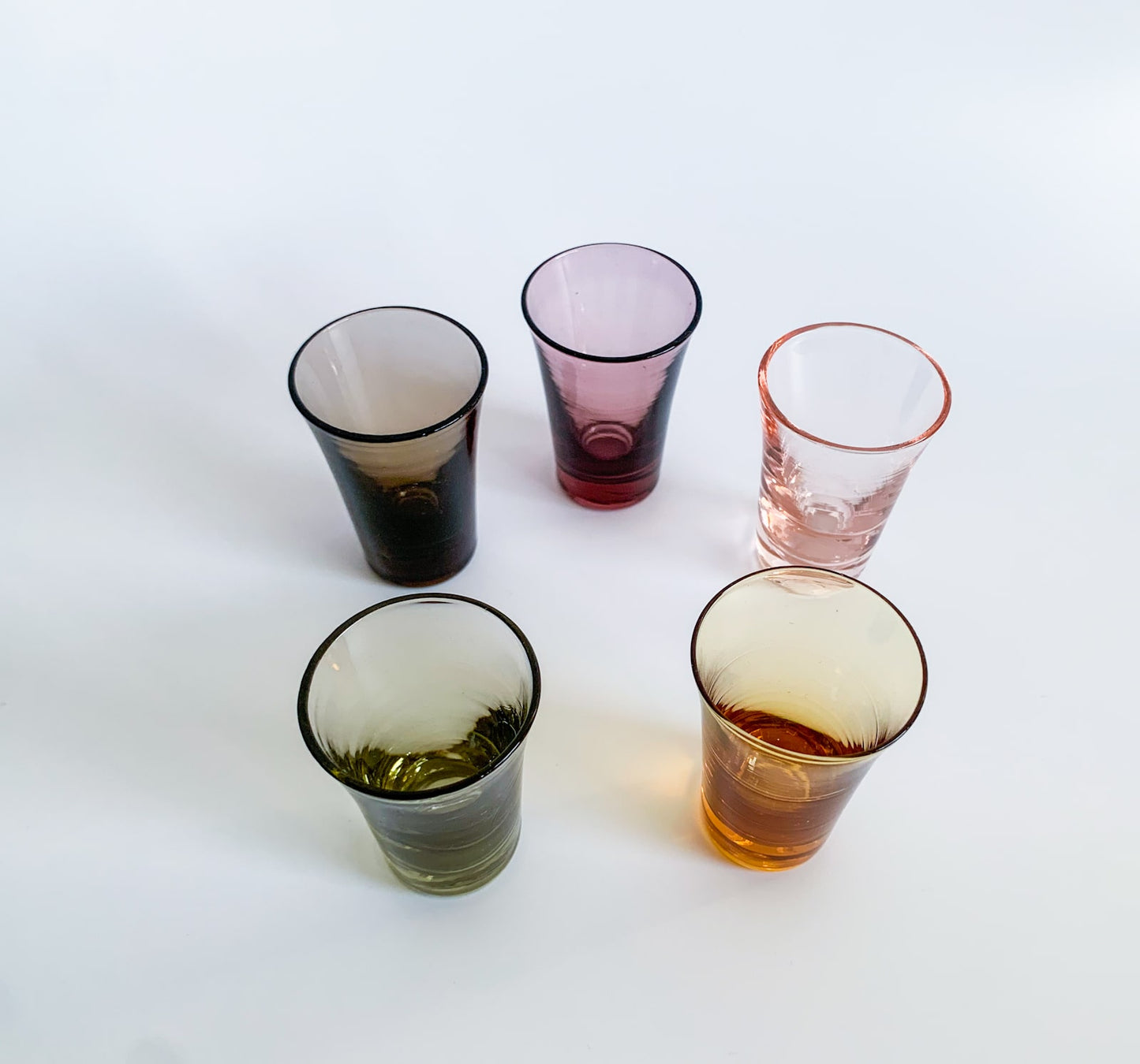 Set of vintage shot glasses in multicolored glass