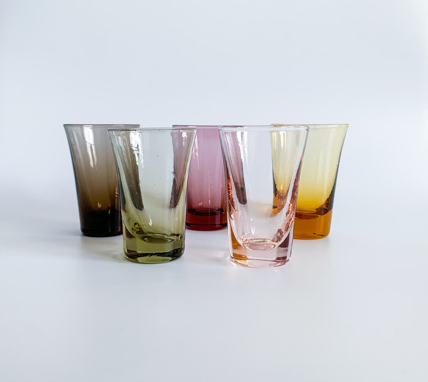 Set of vintage shot glasses in multicolored glass
