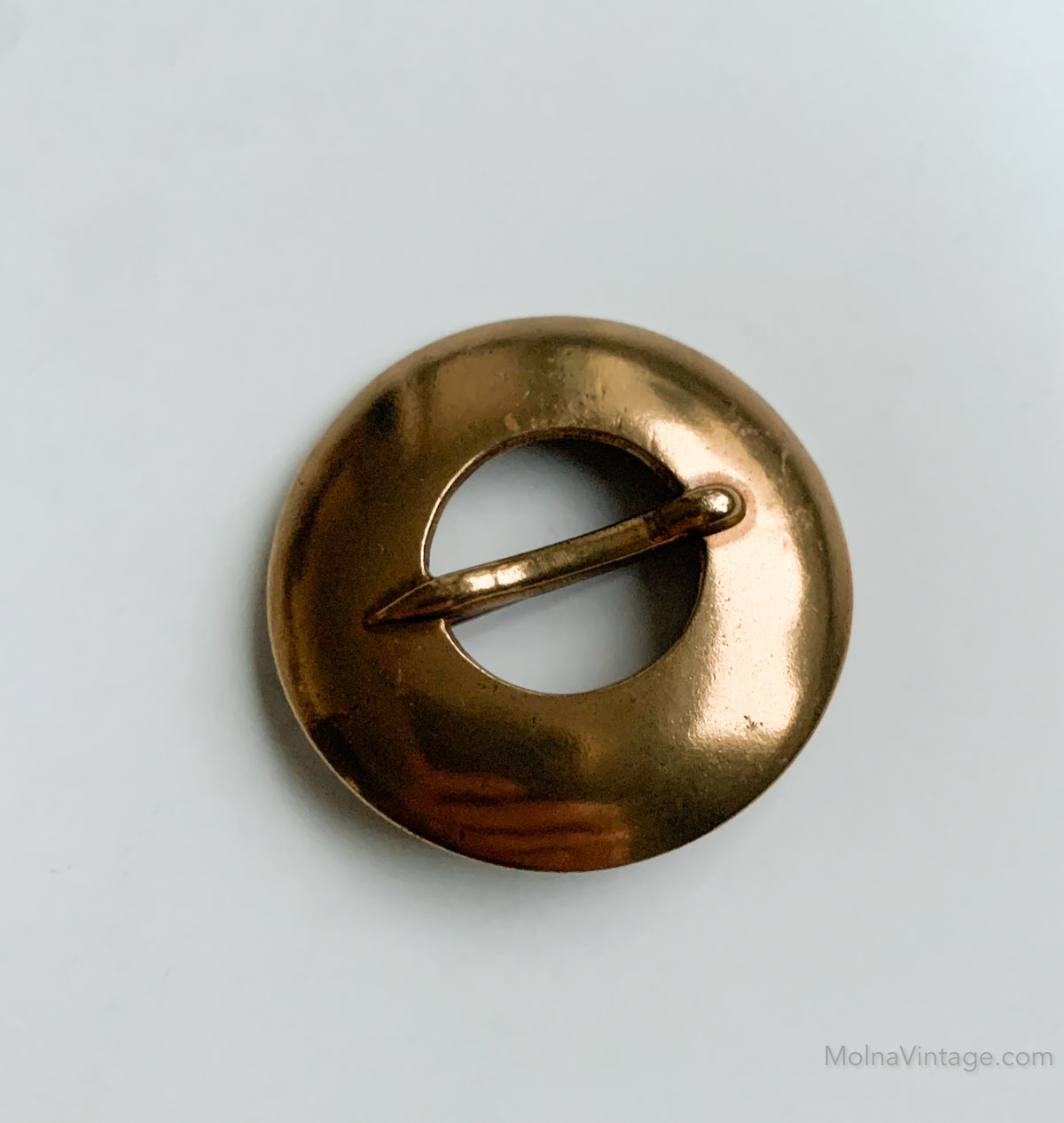 Circular bronze brooch by Kalevala