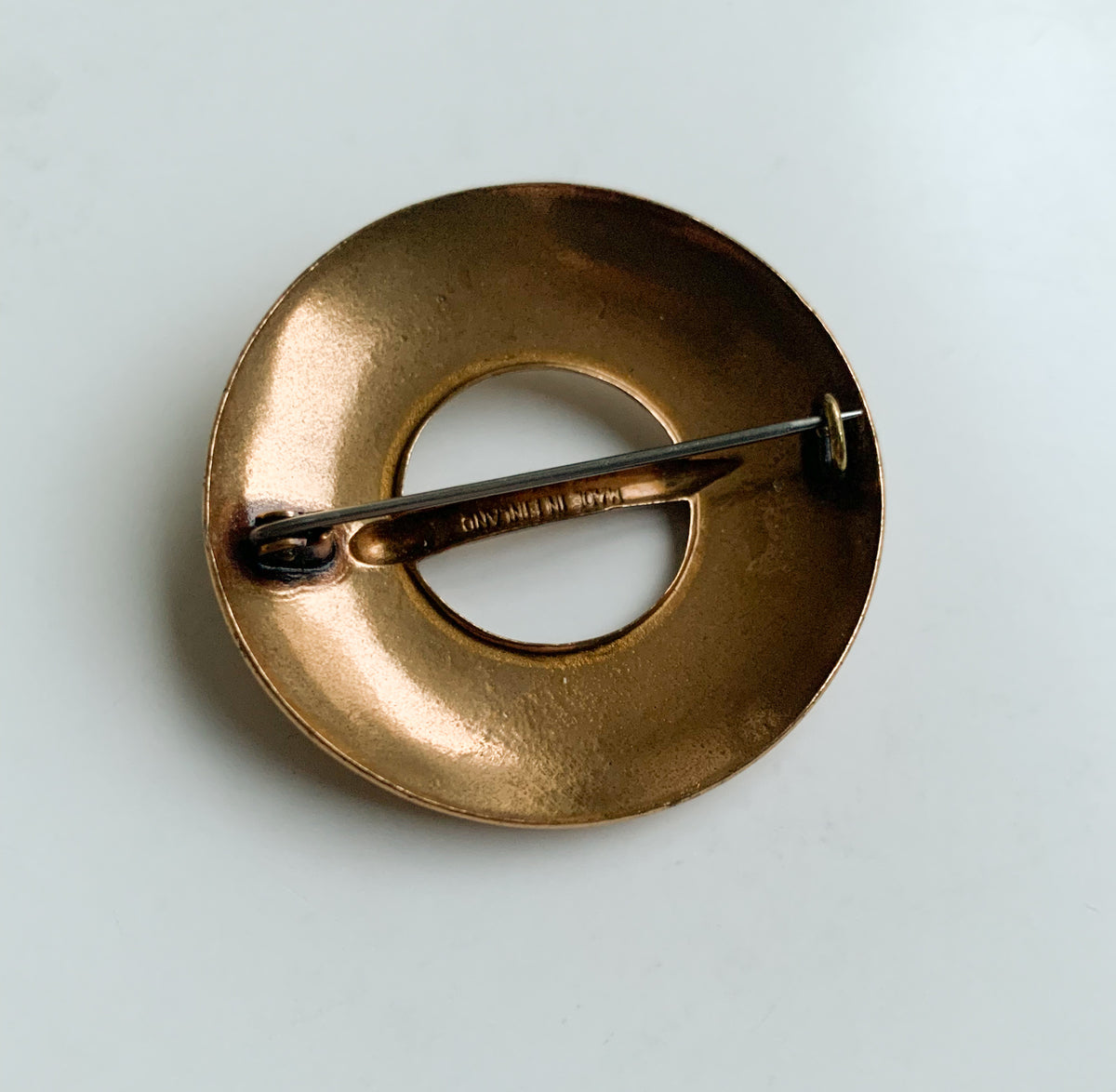 Circular bronze brooch by Kalevala