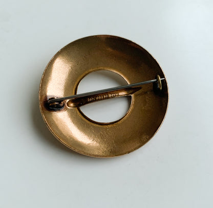 Circular bronze brooch by Kalevala
