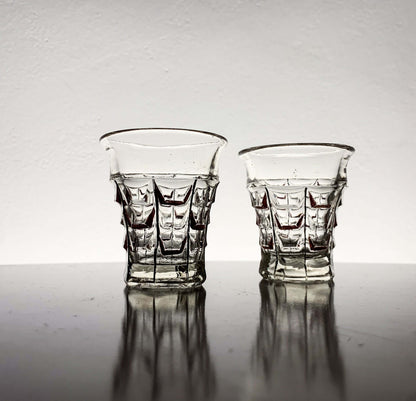 Vintage hand-painted shot glasses by Riihimäen Lasi, 1930s, showcasing pressed geometric design.