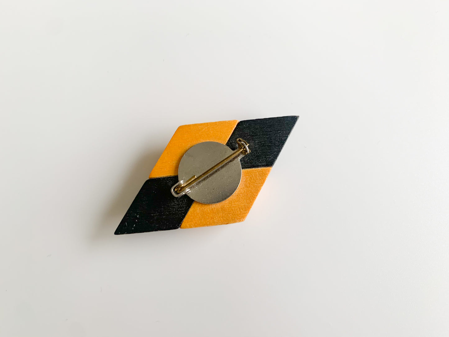 Vintage black and wood colored brooch by Aarikka Finland