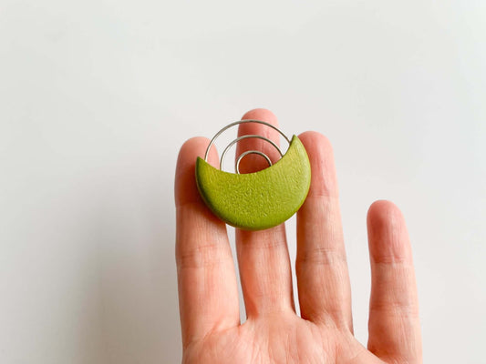 Vibrant lime wood and metal brooch by Aarikka, Finland