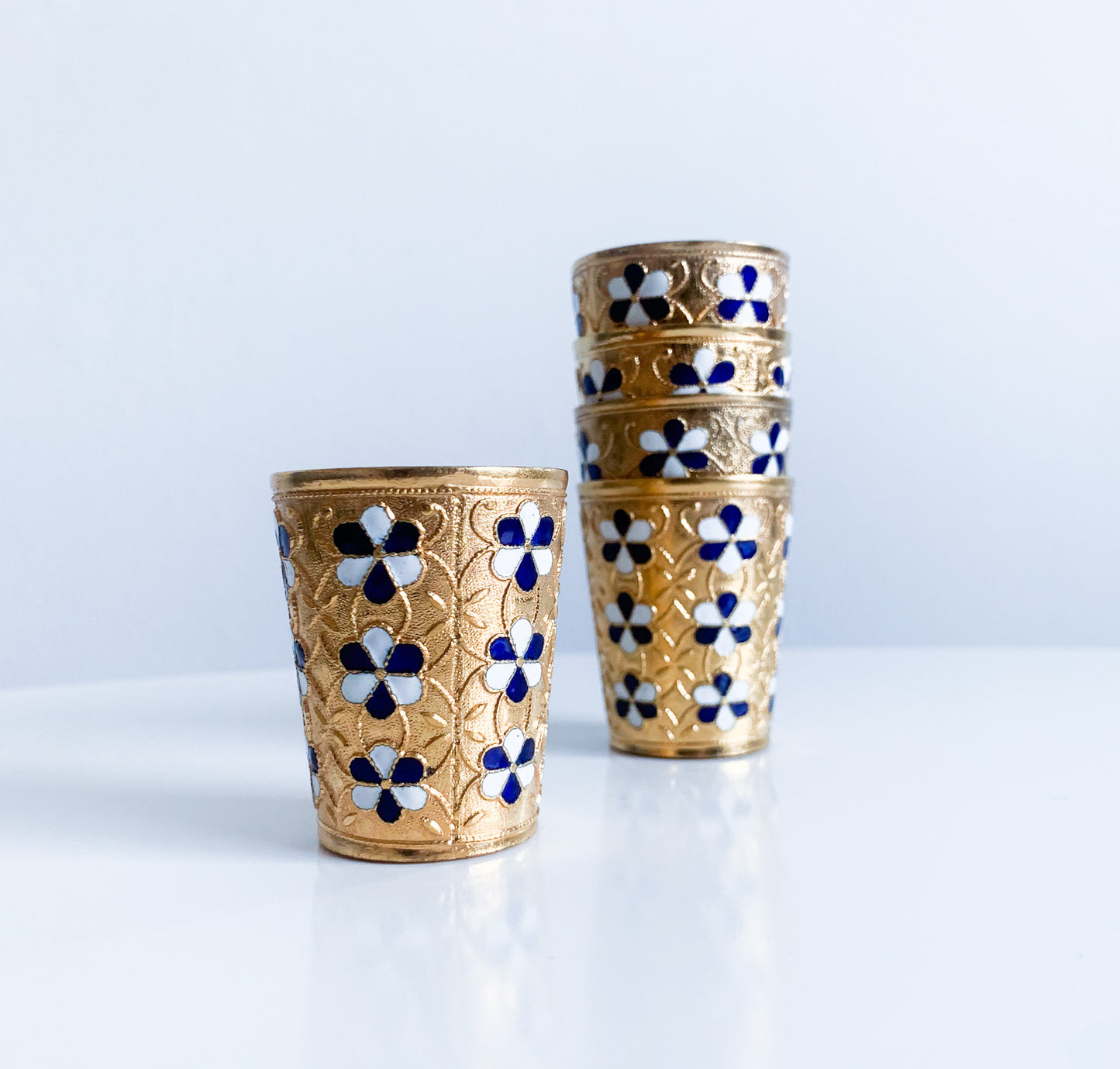 Set of 5 gilt brass vodka cups with enamel flowers | 1960s