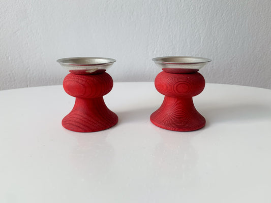 Pair of red wooden candle holders, Aarikka, Finland, 1970s