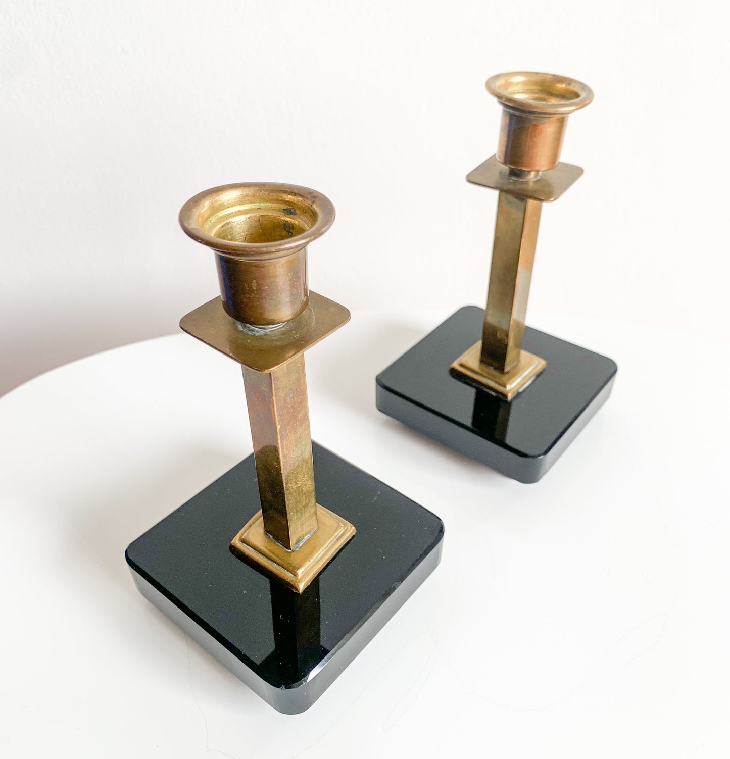 Pair of Swedish Art Deco brass & black glass candlesticks